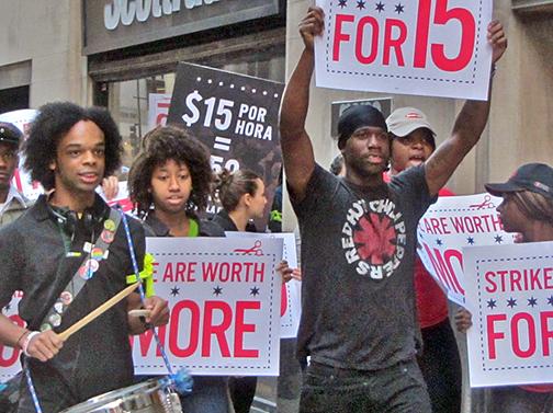 Low-wage workers on strike march for a $15 minimum wage