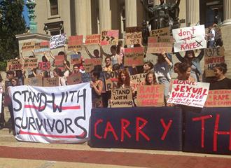 Columbia University students stand with survivors of sexual assault