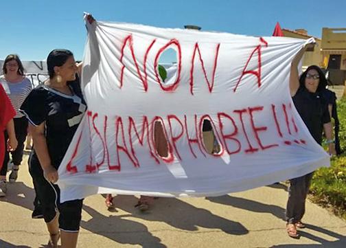 Opponents of Islamophobia march to a French beach to protest the "burkini" ban