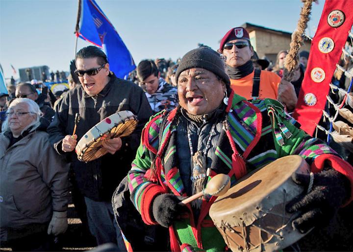 Water protectors celebrate after hearing the U.S. Army Corps of Engineers' decision