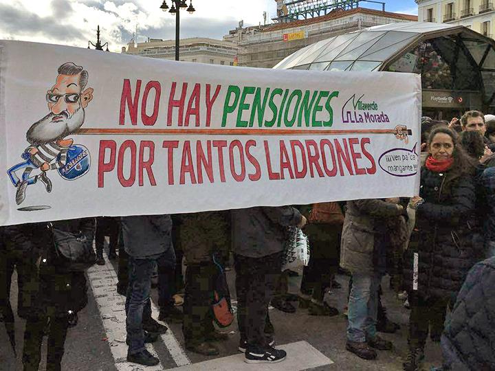 Protesters march against ousted President Mariano Rajoy's pension reforms