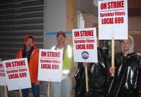 The strike by sprinkler workers has shut down building sites across western Washington