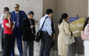 Job seekers wait in line at a Los Angeles job fair