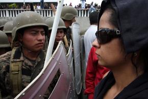 Supporters of President Manuel Zelaya face off against Honduran soldiers at Toncontin Airport