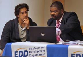 A San Francisco employment services worker offers resume instruction to a job seeker