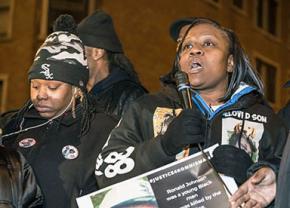 Dorothy Holmes (right) speaks to demonstrators at a rally on the site where RonnieMan was killed