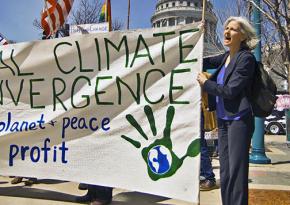 Dr. Jill Stein (right) marching for climate and economic justice in New York