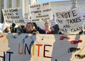 Union defenders rally outside the Supreme Court during arguments in the Friedrichs case