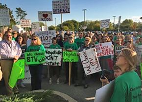 Teachers and community members rally for a fair contract in Burlington, Vermont