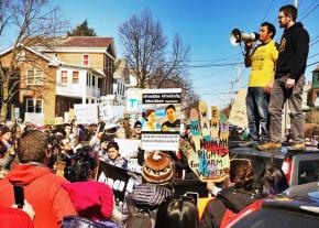 Immigrant rights activist Victor Diaz speaks to a protest against the arrests in Burlington