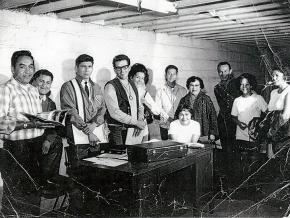 The founding board of the American Indian Movement meets in Minneapolis. Left to right: Harold Goodsky, Charles Deegan, Dennis Banks, Clyde Bellecourt, Peggy Bellcourt, Mr. & Mrs. Barber, Rita Rogers (seated), George Mitchell, Mrs. Mellessy and daughter.