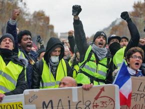 Protesters in the streets of Paris against President Emmanuel Macron’s tax hikes on working people