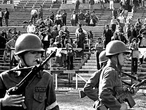 Soldiers watch over leftists and labor organizers in Chile’s National Stadium in 1973